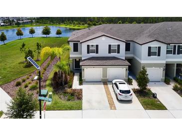 Beautiful townhome with two-car garage and lake view at 2190 Great Sapphire Ln, Lutz, FL 33558