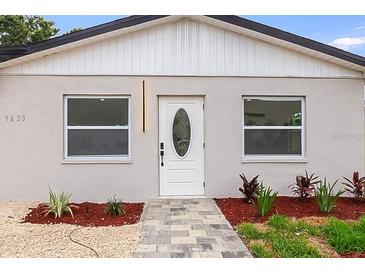 Charming home featuring a modern exterior, well-manicured landscaping, and a welcoming entrance at 7620 N 74Th St, Pinellas Park, FL 33781