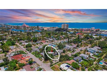 Breathtaking aerial view of the neighborhood with the beach in the distance showcasing the beautiful home at 257 43Rd Ave, St Pete Beach, FL 33706