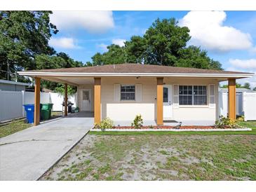 Charming single-story home with a covered front porch and well-maintained lawn at 5109 N 30Th St, Tampa, FL 33610