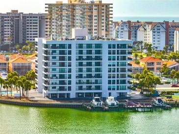 Waterfront condo featuring boat docks and scenic views of the surrounding area at 240 Sand Key Estates Dr # 243, Clearwater Beach, FL 33767