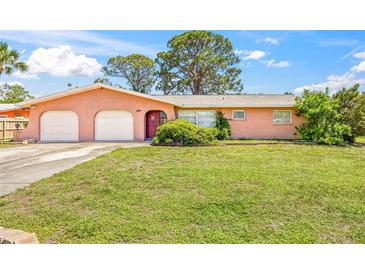 Charming single-story home with a well-maintained lawn and a two-car garage at 358 Suwanee Ave, Sarasota, FL 34243