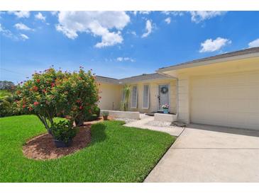 Charming single-story home featuring a well-manicured lawn and inviting curb appeal at 1270 Inverness, Dunedin, FL 34698