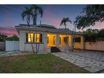 Charming home featuring a carport, a brick driveway, and lush landscaping, offering both style and functionality at 1650 22Nd N Ave, St Petersburg, FL 33713