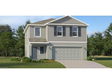 Charming two-story home featuring a two-car garage and a well-manicured lawn at 3805 Ambersweet Xing, Parrish, FL 34219