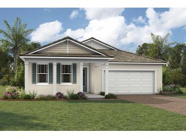 Charming single-story home with a well-manicured lawn, a two-car garage and tropical landscaping at 11730 Myakka Blue Dr, Venice, FL 34293