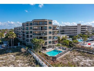 Beautiful multi-story condo building with pool, near the beach and boardwalk at 4510 Gulf Blvd # 604, St Pete Beach, FL 33706