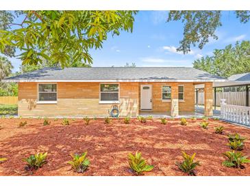 Charming single-story home features a well-manicured front yard with fresh landscaping and a welcoming entrance at 6807 River Rd, Tampa, FL 33615