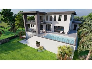 Modern home featuring a pristine pool with outdoor seating areas and spacious balconies overlooking the lush landscape at 26 Harborpointe Dr, Port Richey, FL 34668