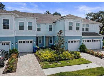 Charming two-story townhome featuring a well-maintained front yard and an attached one car garage at 4020 Via Sienna Cir, Sarasota, FL 34243