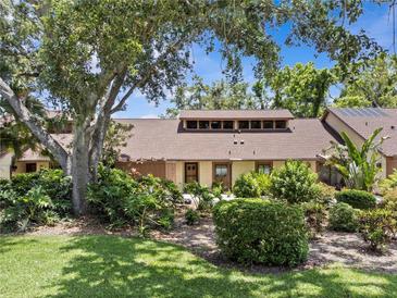 Inviting home exterior showcases lush landscaping and a charming facade, creating a welcoming curb appeal at 7705 4Th W Ave, Bradenton, FL 34209