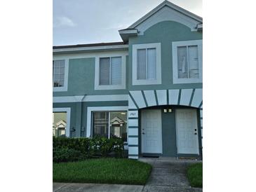 Inviting townhome exterior with well-manicured landscaping and appealing architectural details at 1907 Fluorshire Dr, Brandon, FL 33511