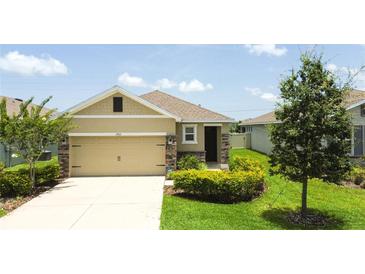 Charming single-story home featuring an attached two-car garage and well-maintained landscaping at 3762 Mossy Limb Ct, Palmetto, FL 34221