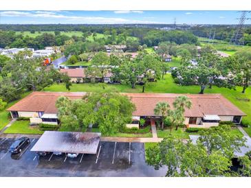 Enjoy this property's lush landscaping and convenient covered parking at 1206 10Th Se Cir, Largo, FL 33771
