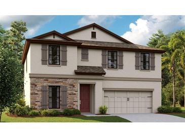 Charming two-story home featuring stone accents, neutral siding, and a two-car garage at 14740 Summer Branch Dr, Lithia, FL 33547