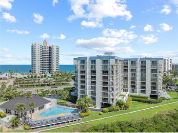 Beautiful ocean view condos, tropical landscaping, and pool offer a luxurious living experience at 1501 Gulf Blvd # 201, Clearwater Beach, FL 33767
