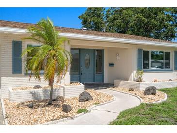 Charming single-story home features a well-manicured lawn, lovely landscaping, and a welcoming front entrance at 6236 17Th S St, St Petersburg, FL 33712