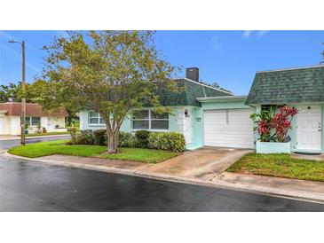 Charming single-story home with a well-manicured lawn and attached garage, perfect for low-maintenance living at 8375 Burgundy N Dr, Pinellas Park, FL 33781