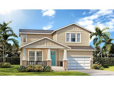 Charming two-story home with well-manicured lawn, stone accents, and a vibrant turquoise front door at 3712 Rocky Island Rd, New Port Richey, FL 34655