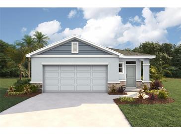 Charming single-story home boasts a two-car garage, landscaped yard, and a light-blue facade at 6755 Broad River Ave, Land O Lakes, FL 34638