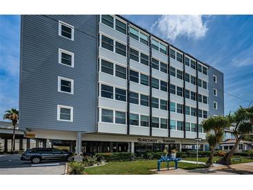 Suncoast Towers building exterior featuring a blue and white facade with well-maintained landscaping at 841 4Th N Ave # 21, St Petersburg, FL 33701
