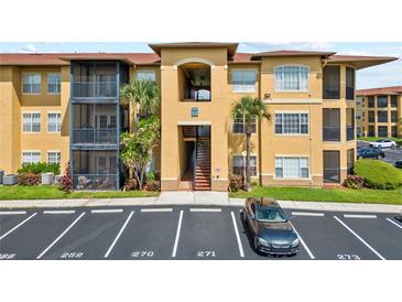 Inviting condo building with well-manicured landscaping and convenient parking at 4306 Bayside Village Dr # 201, Tampa, FL 33615
