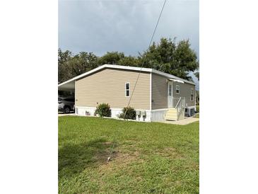 Well maintained single-story home with a carport and easy to maintain landscaping at 5105 Wood St, Zephyrhills, FL 33542