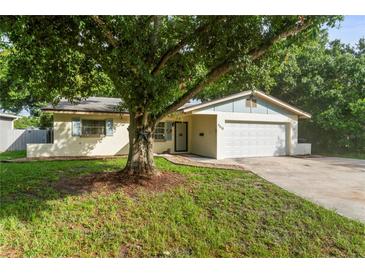 Charming single-story home featuring a well-maintained lawn and a two-car garage, perfect for suburban living at 5210 Dr Martin Luther King Jr St N St, St Petersburg, FL 33703