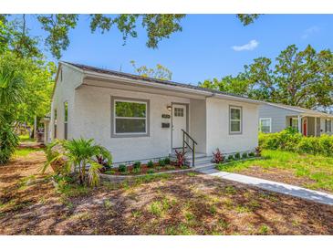 Charming single-story home with a well-maintained stucco exterior, landscaped front yard, and welcoming entrance at 2326 Auburn S St, St Petersburg, FL 33712