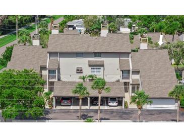 Exterior view of a home showing the carport parking and beige facade at 4777 Duhme Rd # 1D, St Petersburg, FL 33708