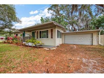 Charming single-story home with a well-manicured lawn and attached two-car garage at 2316 Lancaster Dr, Clearwater, FL 33764