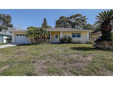 Charming one-story home with a well-maintained lawn and attached garage at 5483 37Th N Ave, St Petersburg, FL 33710