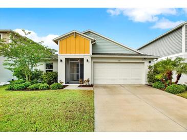 Charming single-Gathering home featuring a well-manicured lawn and two-car garage at 13111 Fruitville Way, Riverview, FL 33579