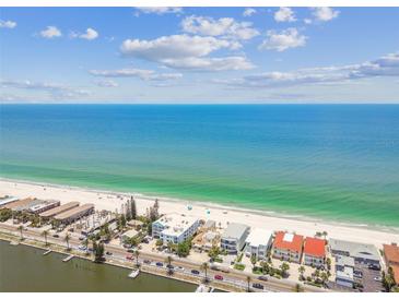 Stunning aerial view showcasing beachfront property with turquoise ocean and white sandy beach at 30 Gulf Blvd, Indian Rocks Beach, FL 33785