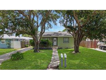 Charming single-story home with a well-maintained lawn and mature trees at 5725 18Th S Ave, Gulfport, FL 33707