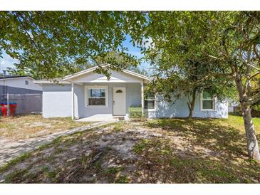 Charming single-story home with a mature tree providing shade in the front yard at 12660 118Th St, Largo, FL 33778
