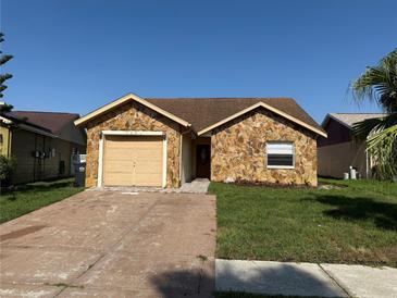 Charming single-story home with stone facade and well-maintained lawn at 1331 Coolmont Dr, Brandon, FL 33511