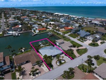 Beautiful waterfront property with a private boat dock and a stunning view of the ocean at 202 Howard Dr, Belleair Beach, FL 33786