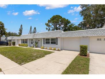Charming single-story villa with a well-maintained lawn and a private garage in a friendly neighborhood at 204 Mindy Dr, Largo, FL 33771