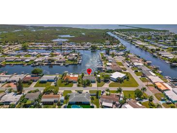 Waterfront homes with canal access, lush landscaping, and an incredible view of the surrounding waterways at 12829 3Rd Isle, Hudson, FL 34667