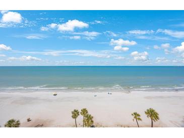 Expansive beach view with turquoise water and sandy shoreline, perfect for relaxation and recreation at 14950 Gulf Blvd # 902, Madeira Beach, FL 33708