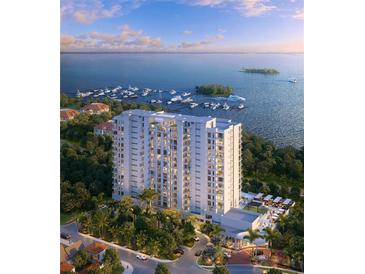 Stunning aerial view of a high-rise condo overlooking a marina and scenic waterfront at 5701 Bowen Daniel Dr. # 806, Tampa, FL 33616