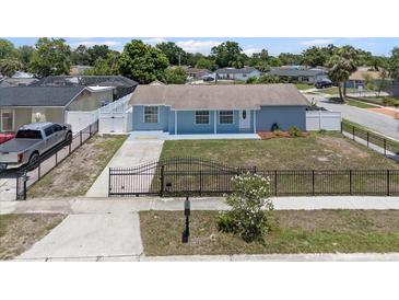 Charming single-story home featuring a well-maintained yard, fenced perimeter, and private driveway at 6417 Willow Wood Ln, Tampa, FL 33634