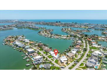 Stunning aerial view of a waterfront neighborhood featuring beautiful homes and access to canals and the open water at 7892 10Th S Ave, St Petersburg, FL 33707