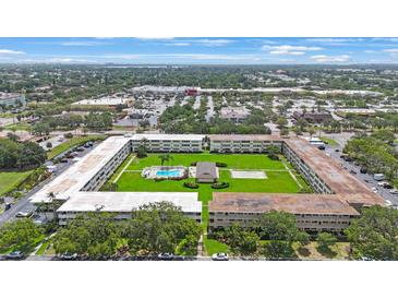 Scenic aerial view of the community featuring a lush green space and a refreshing pool at 8100 Dr Martin Luther King Jr N St # 202, St Petersburg, FL 33702