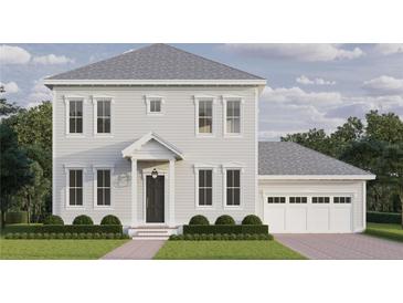 Charming two-story home with a well-manicured lawn, attached garage, and a welcoming entrance at 1008 Montrose N Blvd, St Petersburg, FL 33703