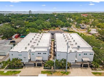 An eye-level aerial view of the community highlighting manicured landscaping and nearby trees at 5008 S Macdill Ave # 16, Tampa, FL 33611