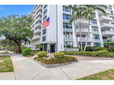 The Harbour Hill building's exterior featuring lush landscaping and a clear building entrance at 700 Beach Ne Dr # 602, St Petersburg, FL 33701