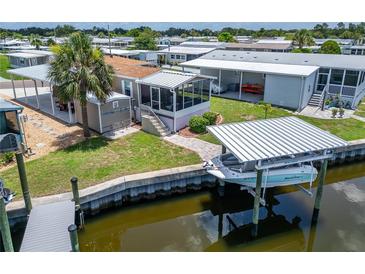 Waterfront home featuring screened lanai, boat dock, and lift at 108 W Saint Annes Cir, Apollo Beach, FL 33572