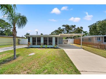 Charming single-story home with a well-maintained lawn and convenient carport, a delightful curb appeal at 11829 104Th St, Largo, FL 33773